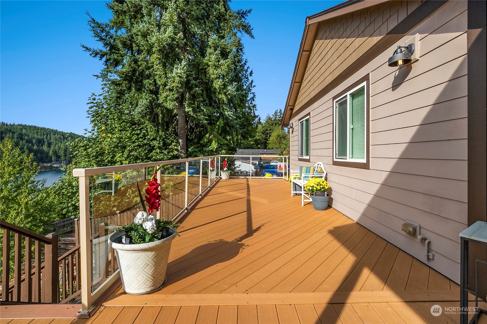 1124 Summit Lake Shore Road Northwest Olympia, WA 98502 - Photo 37 of 40 a view of a patio with couches chairs and potted plants