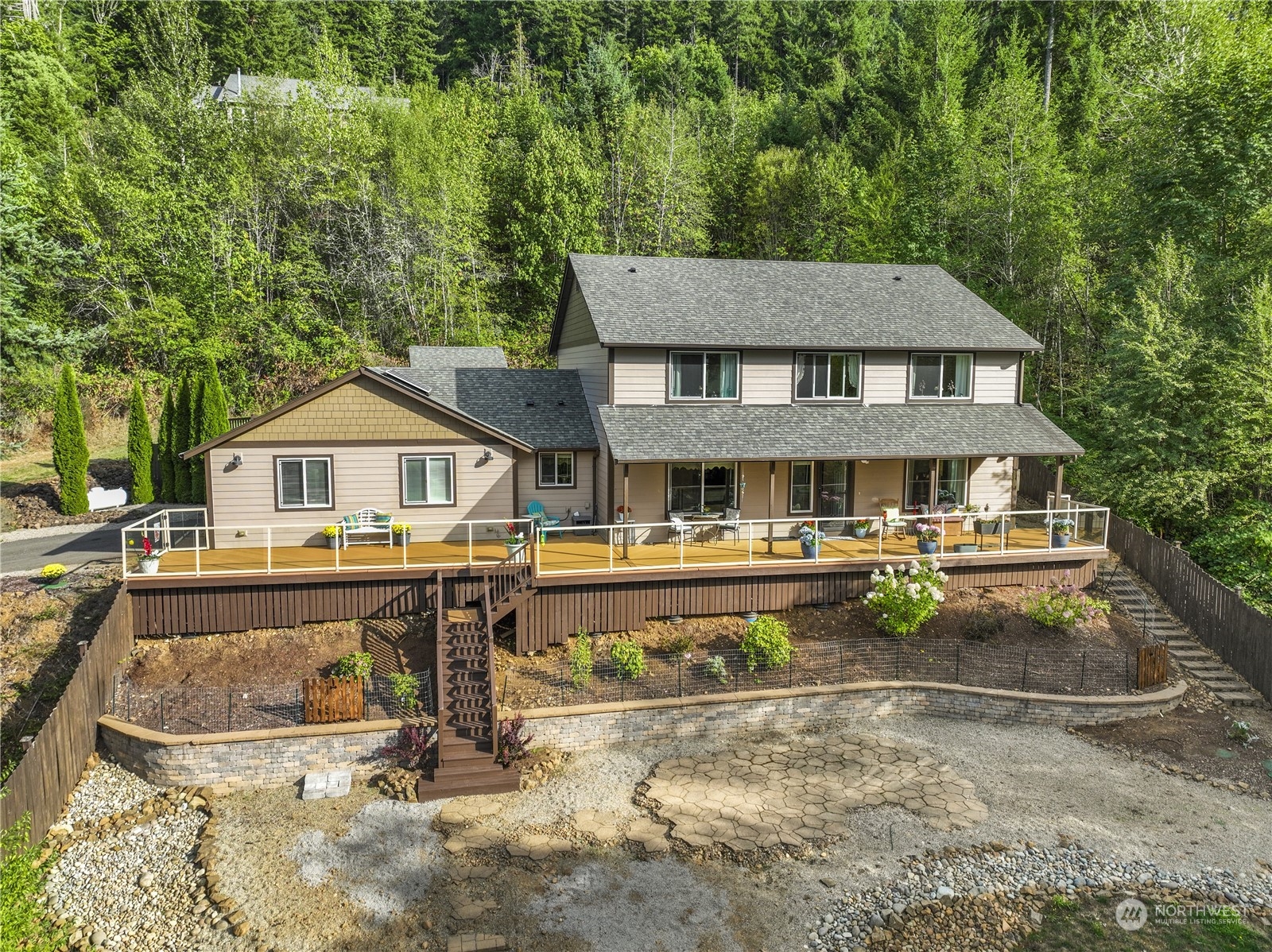 1124 Summit Lake Shore Road Northwest Olympia, WA 98502 - Photo 4 of 40 a front view of a house with swimming pool