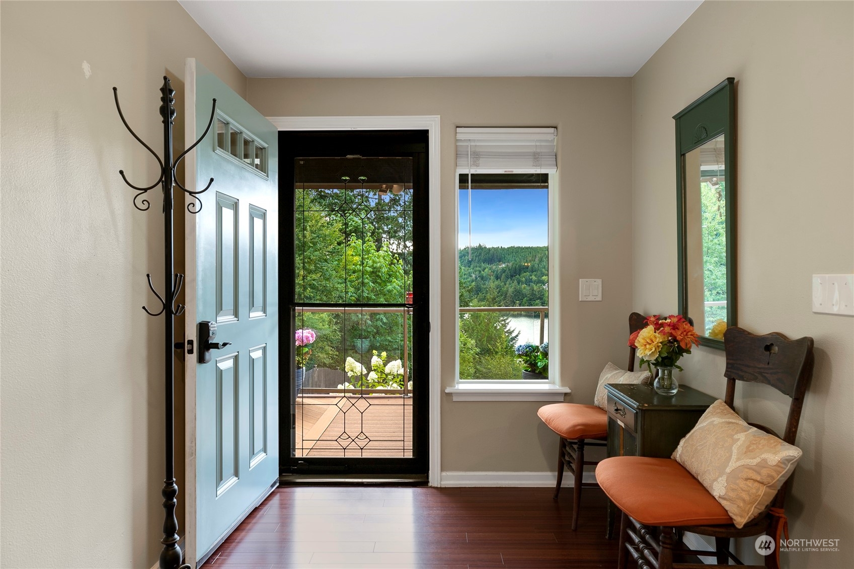 1124 Summit Lake Shore Road Northwest Olympia, WA 98502 - Photo 5 of 40 a living room with furniture and a floor to ceiling window