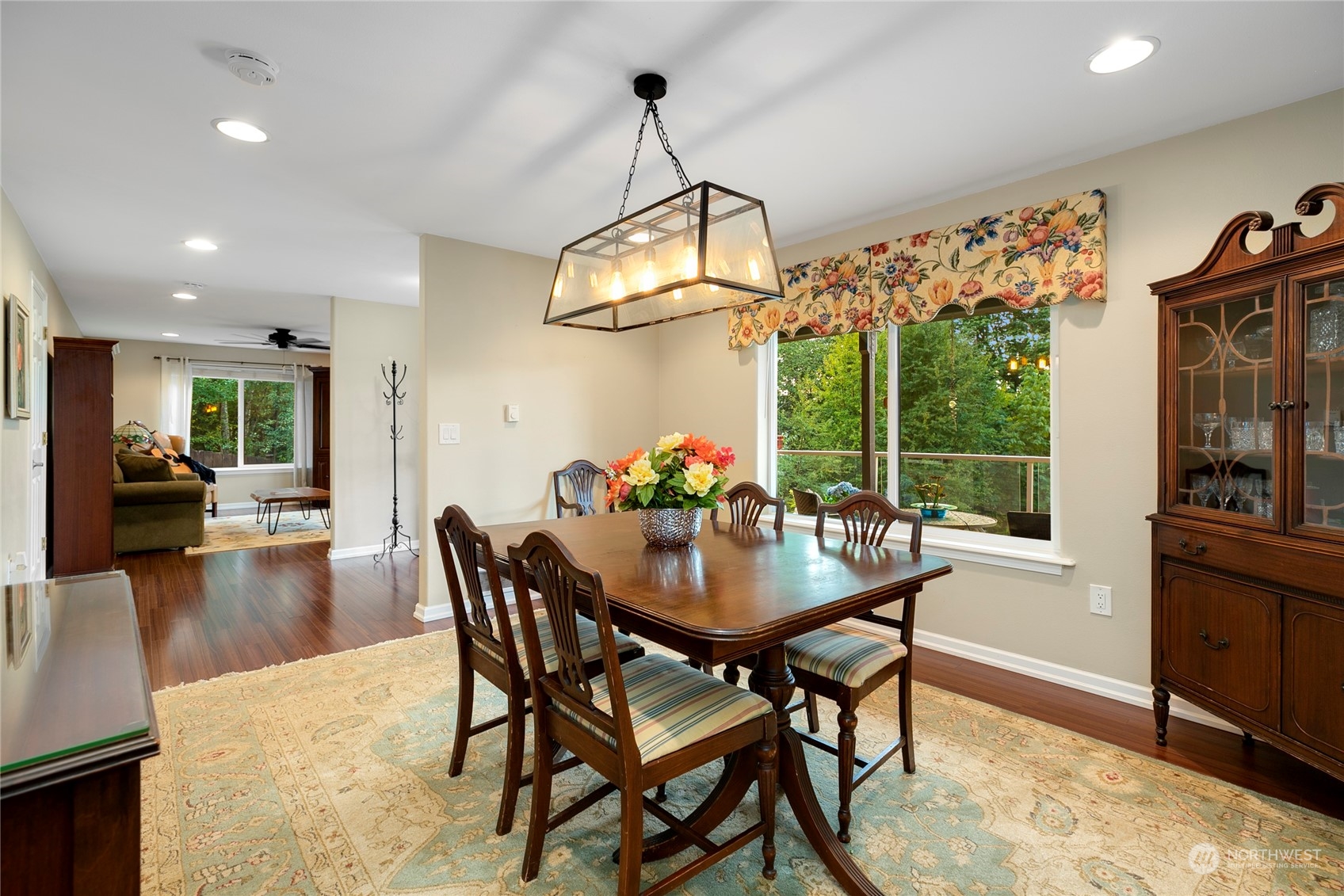 1124 Summit Lake Shore Road Northwest Olympia, WA 98502 - Photo 6 of 40 a dining room with furniture a chandelier and wooden floor