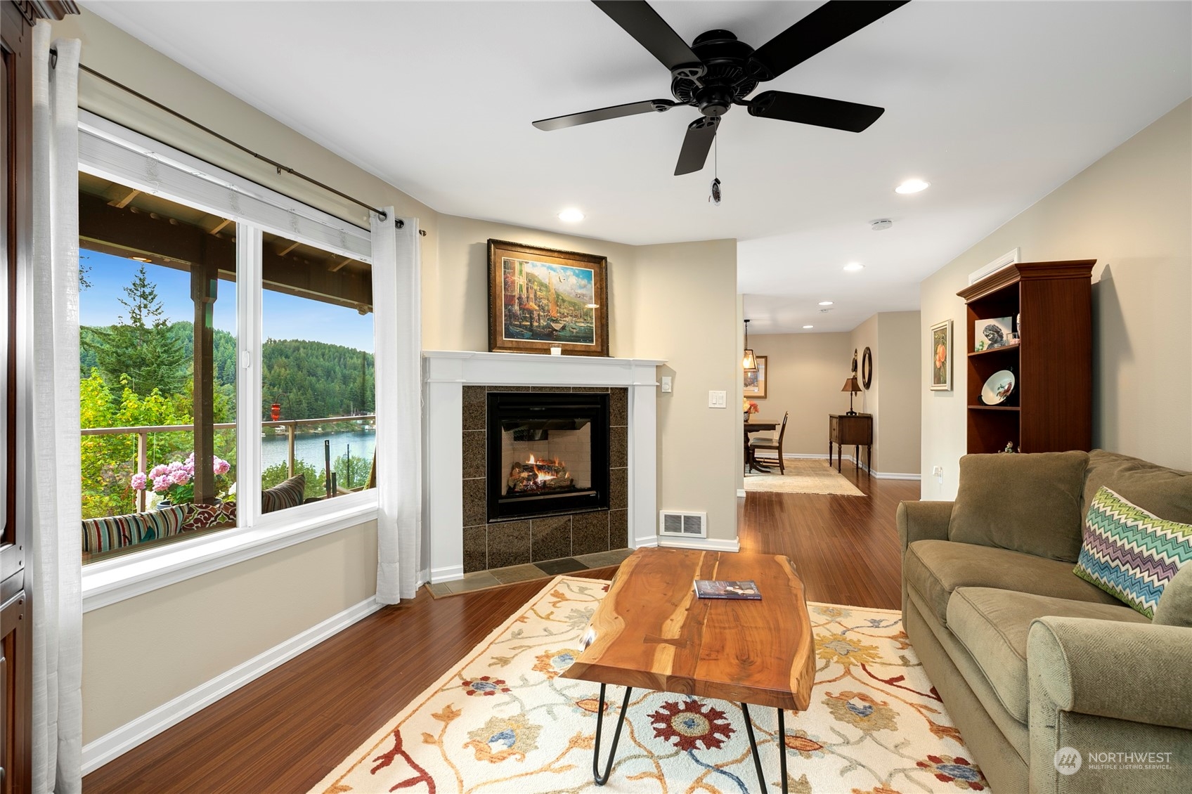 1124 Summit Lake Shore Road Northwest Olympia, WA 98502 - Photo 8 of 40 a living room with furniture and a fireplace