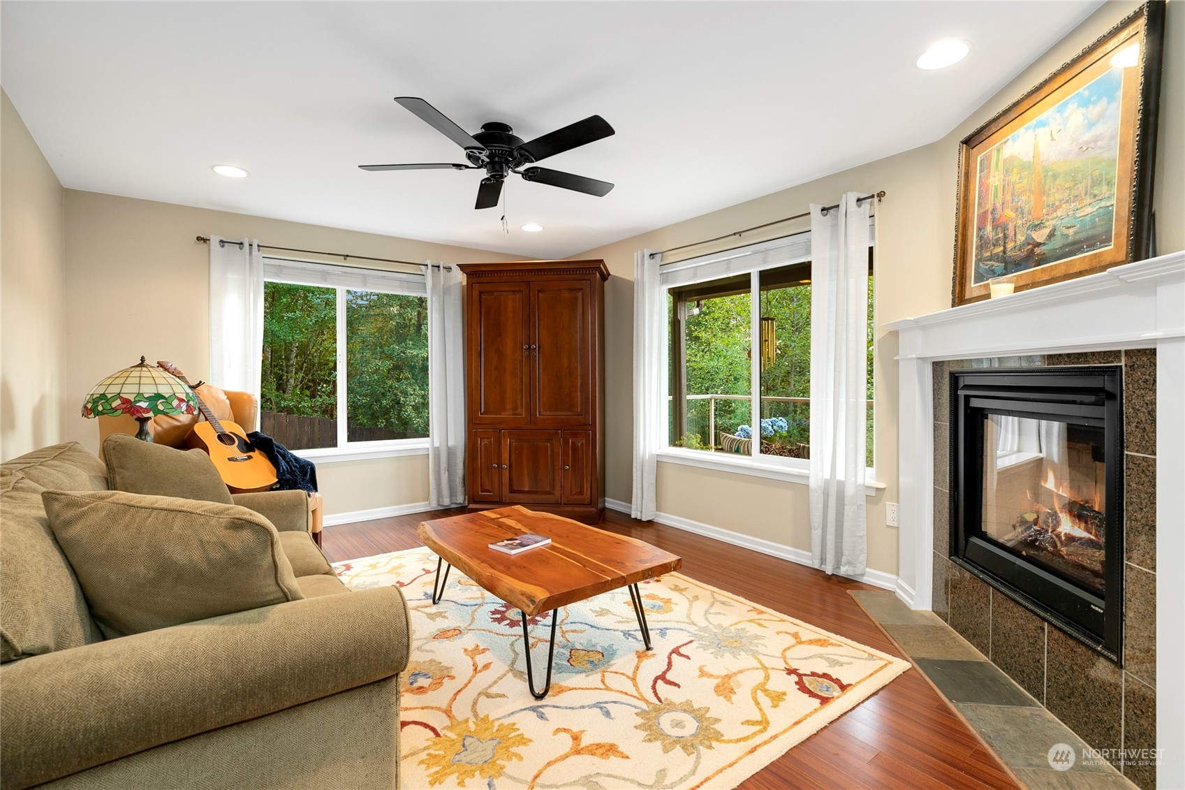 1124 Summit Lake Shore Road Northwest Olympia, WA 98502 - Photo 9 of 40 a living room with furniture and a fireplace