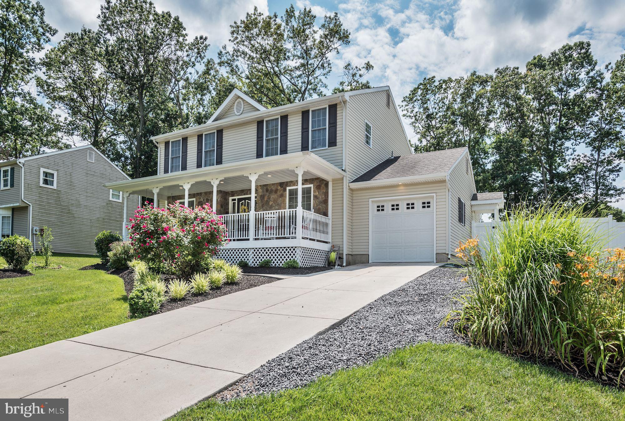 6 Mariner Drive Sewell, NJ 08080 - Photo 2 of 32 a front view of a house with a garden and trees
