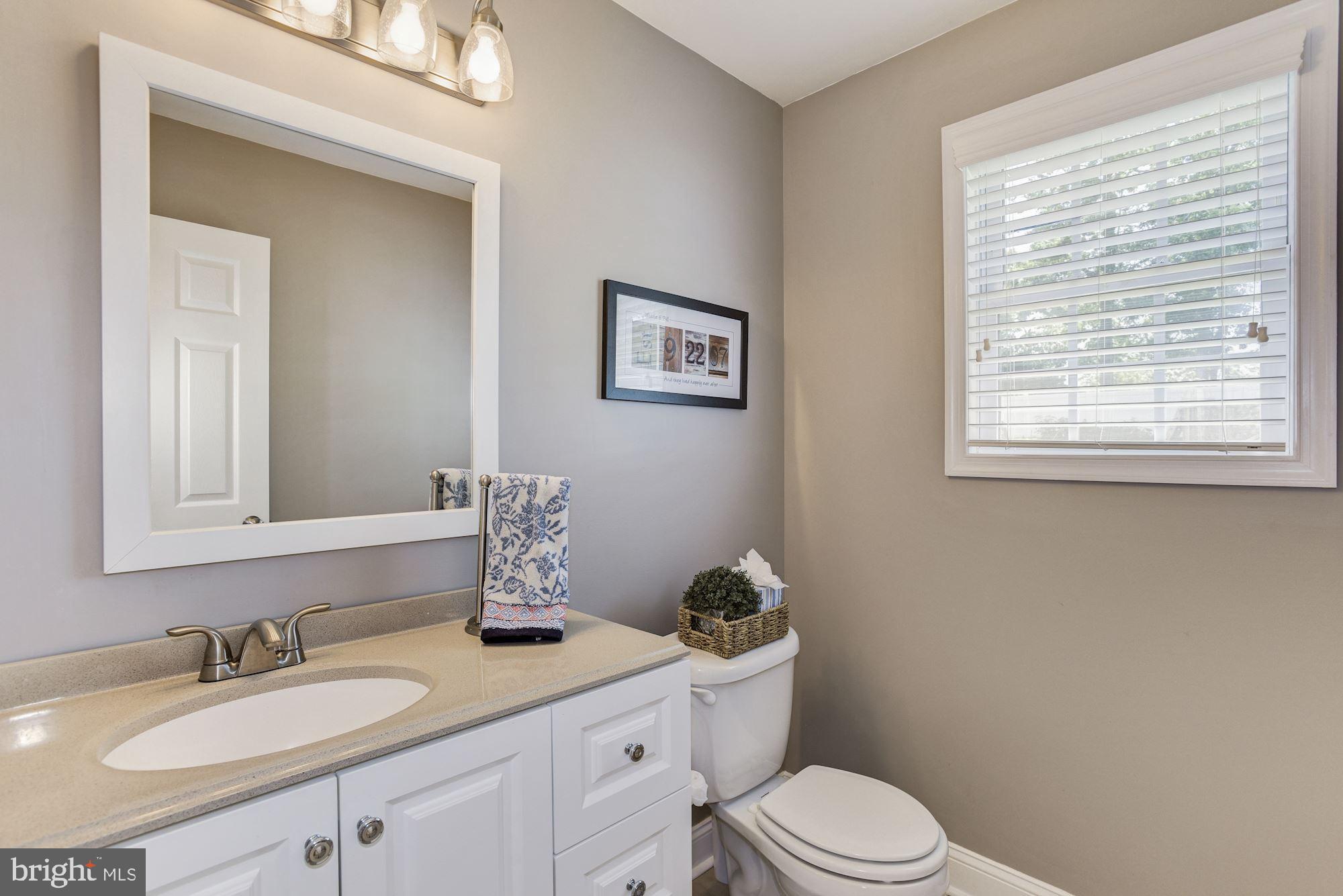 6 Mariner Drive Sewell, NJ 08080 - Photo 18 of 32 a bathroom with a granite countertop toilet sink and mirror