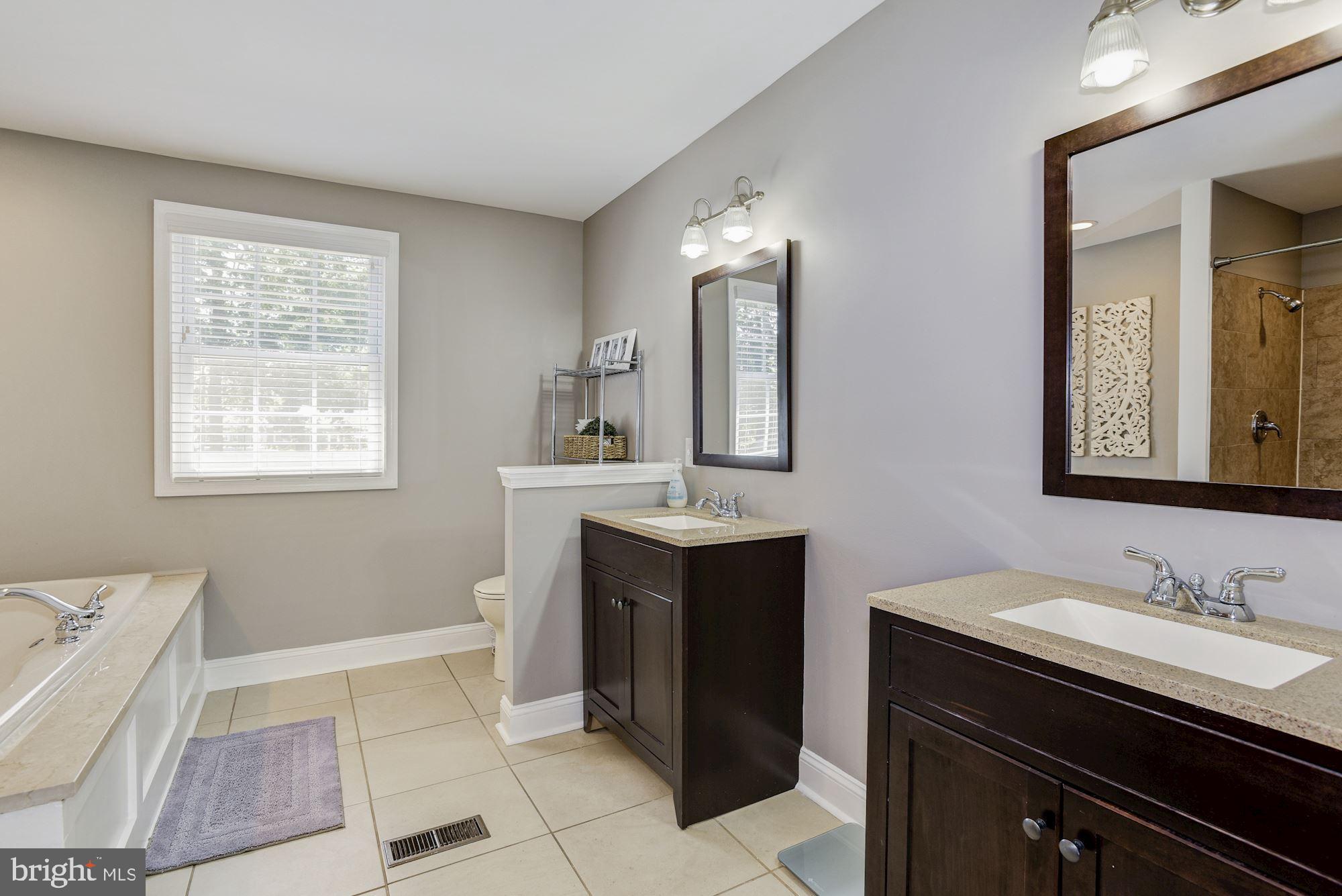6 Mariner Drive Sewell, NJ 08080 - Photo 22 of 32 a spacious bathroom with a sink double vanity and a mirror