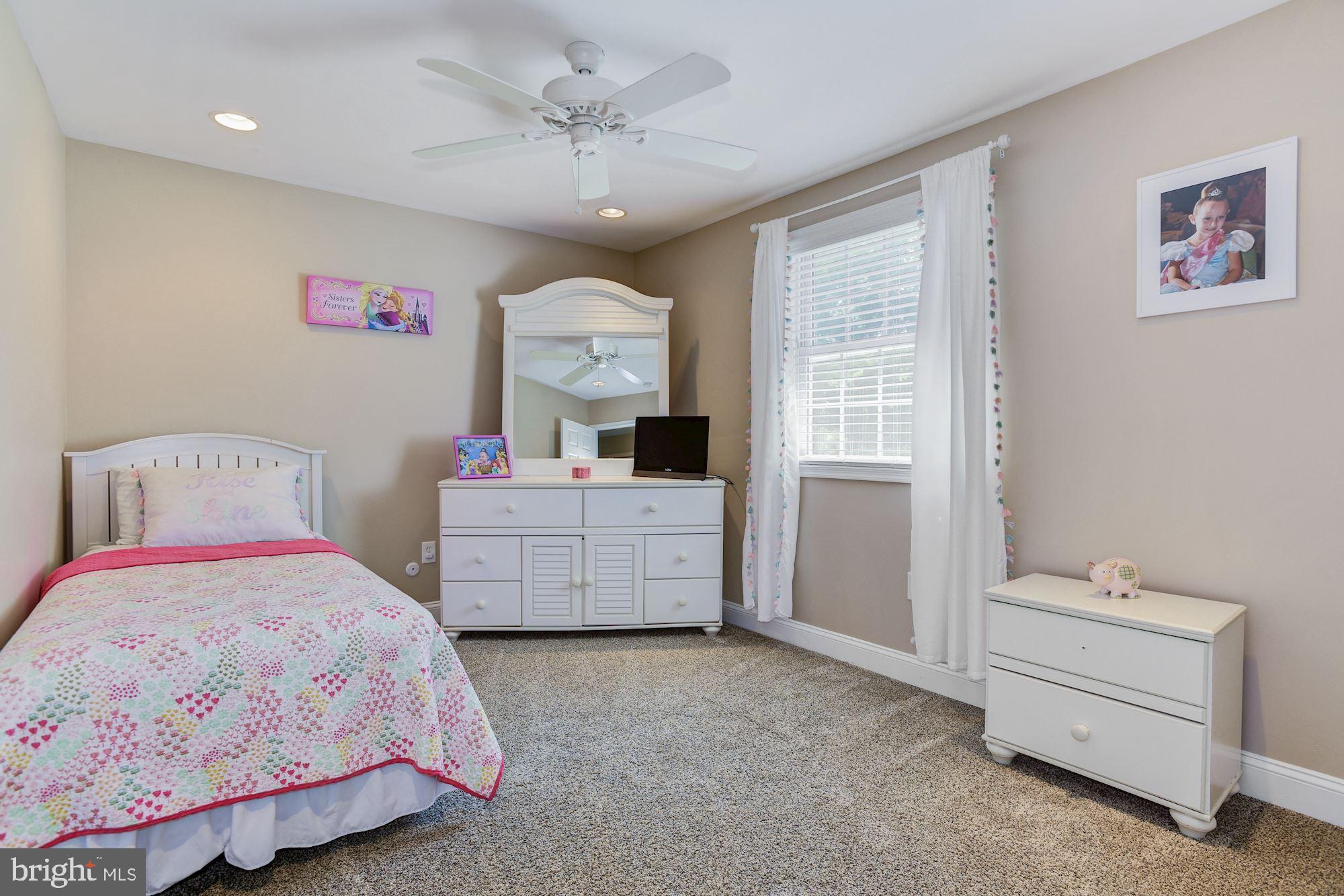 6 Mariner Drive Sewell, NJ 08080 - Photo 24 of 32 a bedroom with a bed and a chandelier