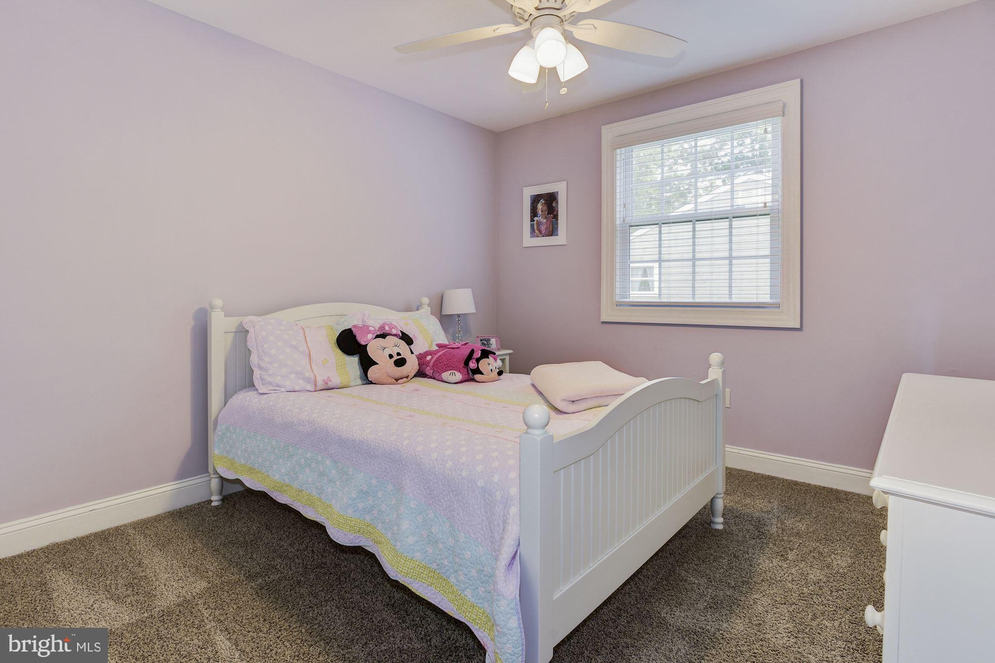 6 Mariner Drive Sewell, NJ 08080 - Photo 25 of 32 a room with a bed and a chandelier