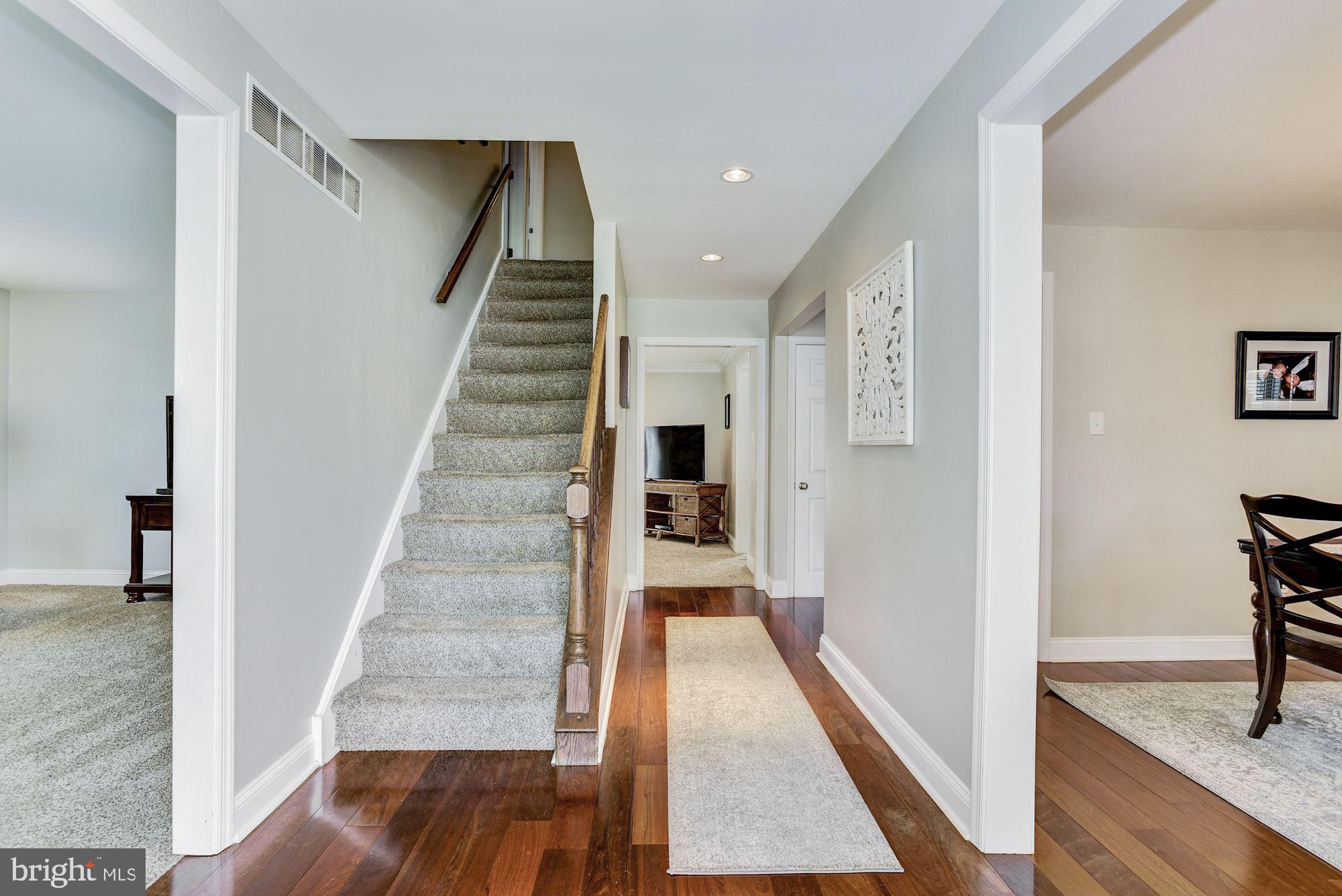 6 Mariner Drive Sewell, NJ 08080 - Photo 5 of 32 a view of a hallway with wooden floor and staircase