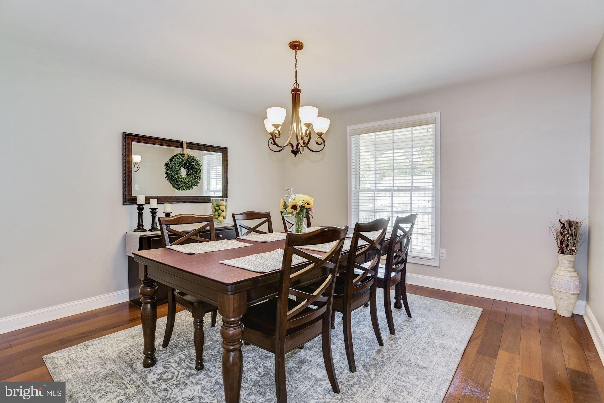 6 Mariner Drive Sewell, NJ 08080 - Photo 9 of 32 a view of a dining room with furniture and chandelier