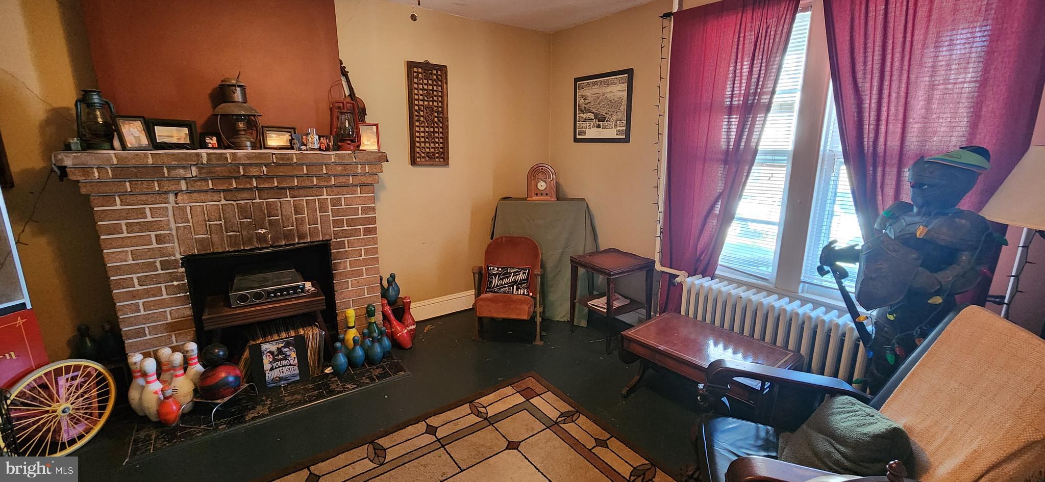 349 High Street Chestertown, MD 21620 - Photo 12 of 33 a living room with furniture a fireplace and a window