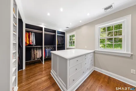 a kitchen with wooden cabinets and a window