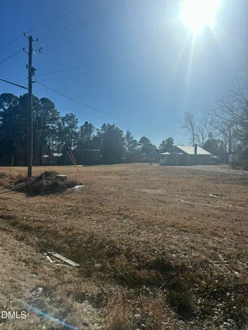a view of a lake with a yard