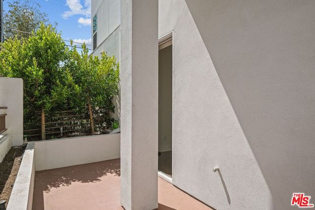a view of balcony with furniture