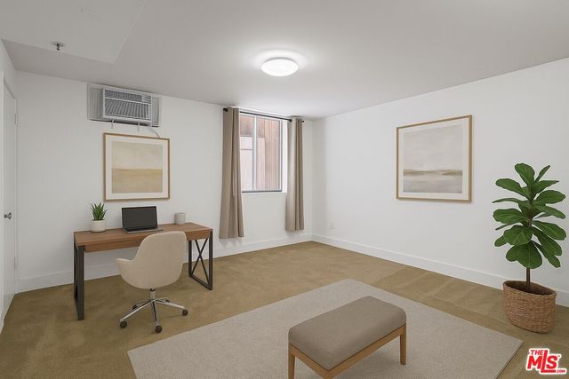 a workspace with furniture and a window