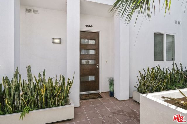 a view of a potted plants in front of a door