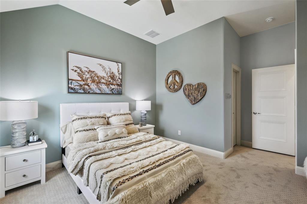 1604 Casting Ridge Mesquite, TX 75181 - Photo 30 of 38 Vaulted ceiling with a ceiling fan, light gray wall paint, white trim, and light-colored carpet flooring