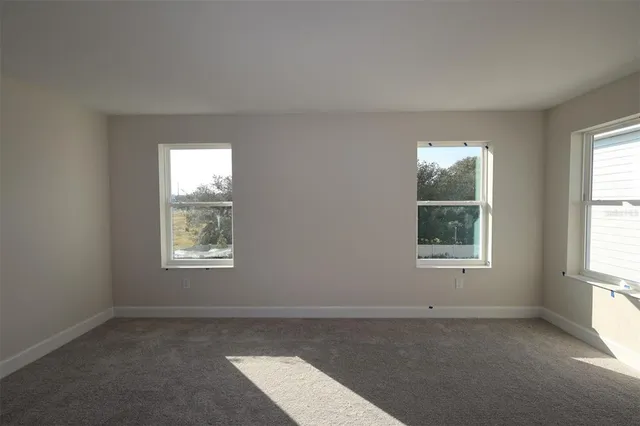 an empty room with windows