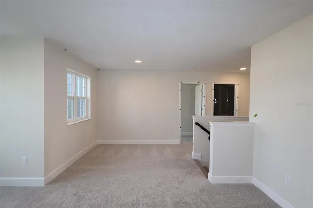 a view of livingroom with kitchen furniture and wooden floor