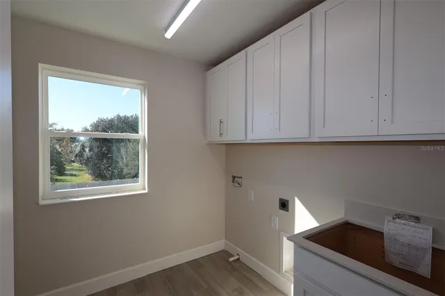 a view of cabinets and window