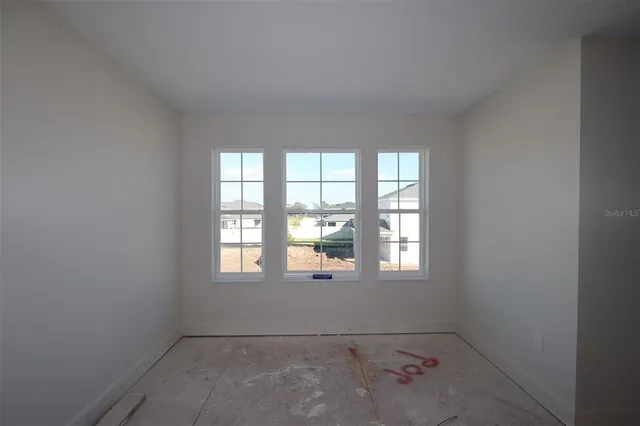 an empty room with windows