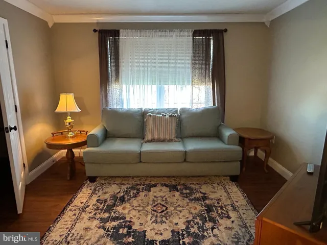 a living room with furniture and a couch