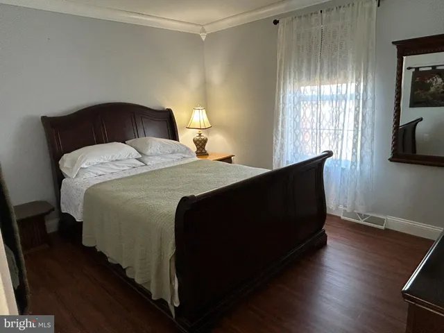 a bedroom with bed and window