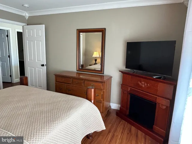 a bedroom with a bed and a mirror