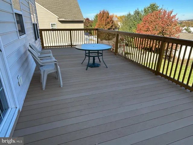 an outdoor view of the house with a yard