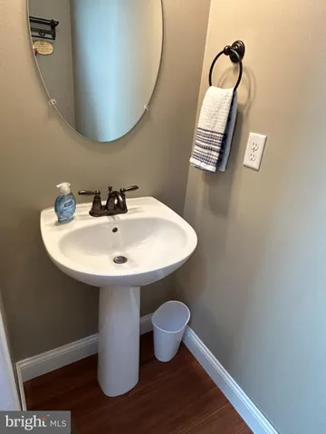 a bathroom with a sink and mirror