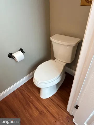 a white toilet sitting next to a bathroom sink