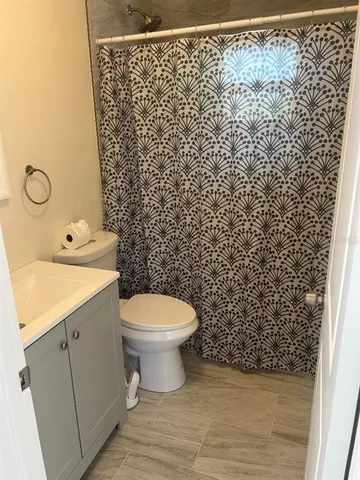 a bathroom with a toilet and a sink