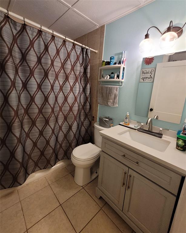 117 West 3rd Street, Unit A Keene, TX 76059 - Photo 14 of 14 a bathroom with a sink and a toilet