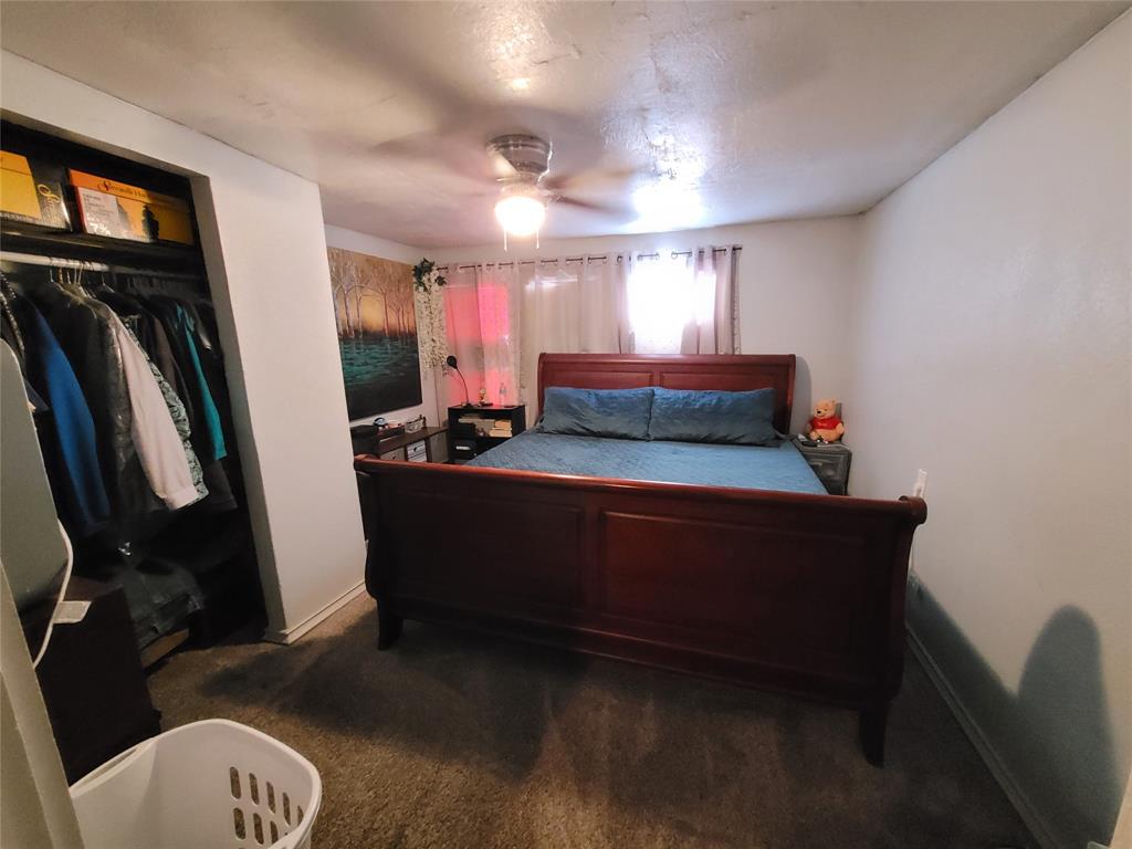 117 West 3rd Street, Unit A Keene, TX 76059 - Photo 8 of 14 a living room with furniture and a window