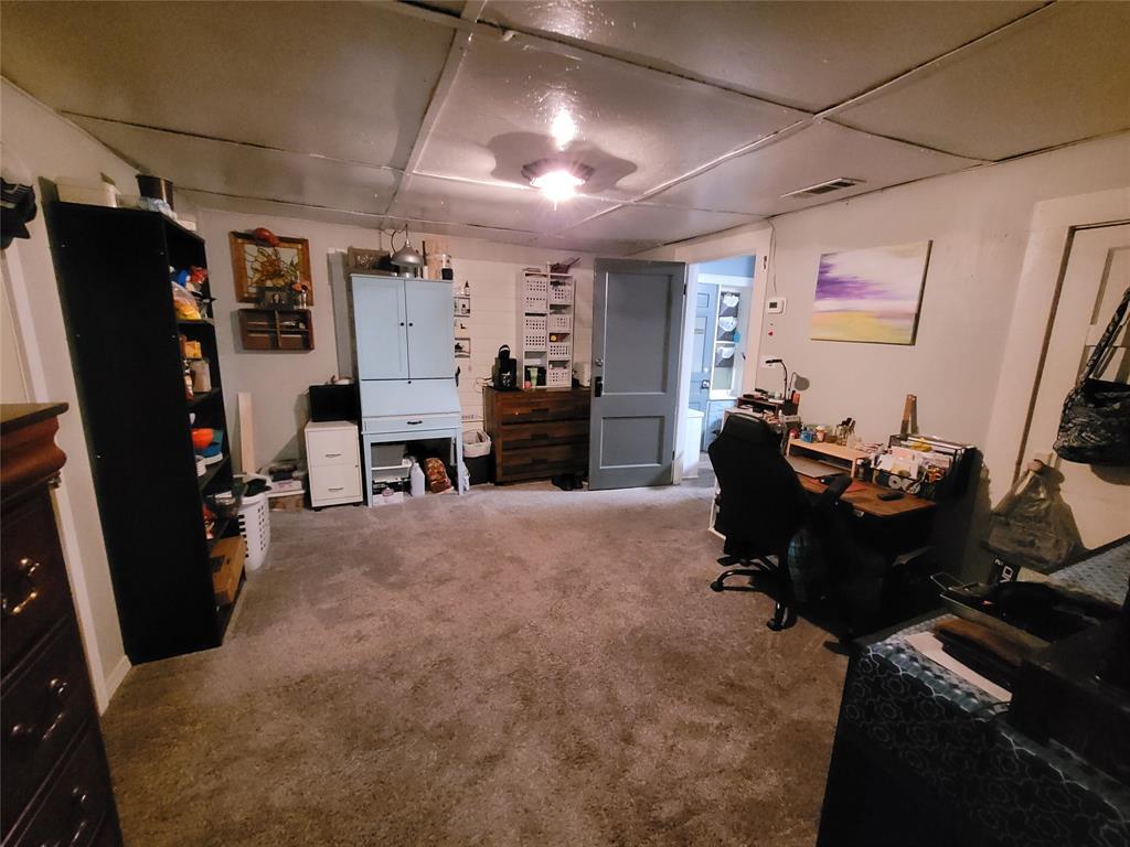 117 West 3rd Street, Unit A Keene, TX 76059 - Photo 10 of 14 a living room with furniture and a flat screen tv