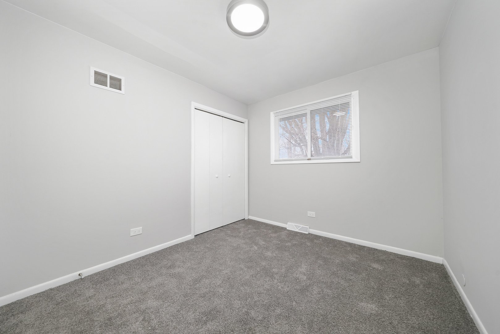 17522 Wright Street Lansing, IL 60438 - Photo 15 of 21 an empty room with windows and closet