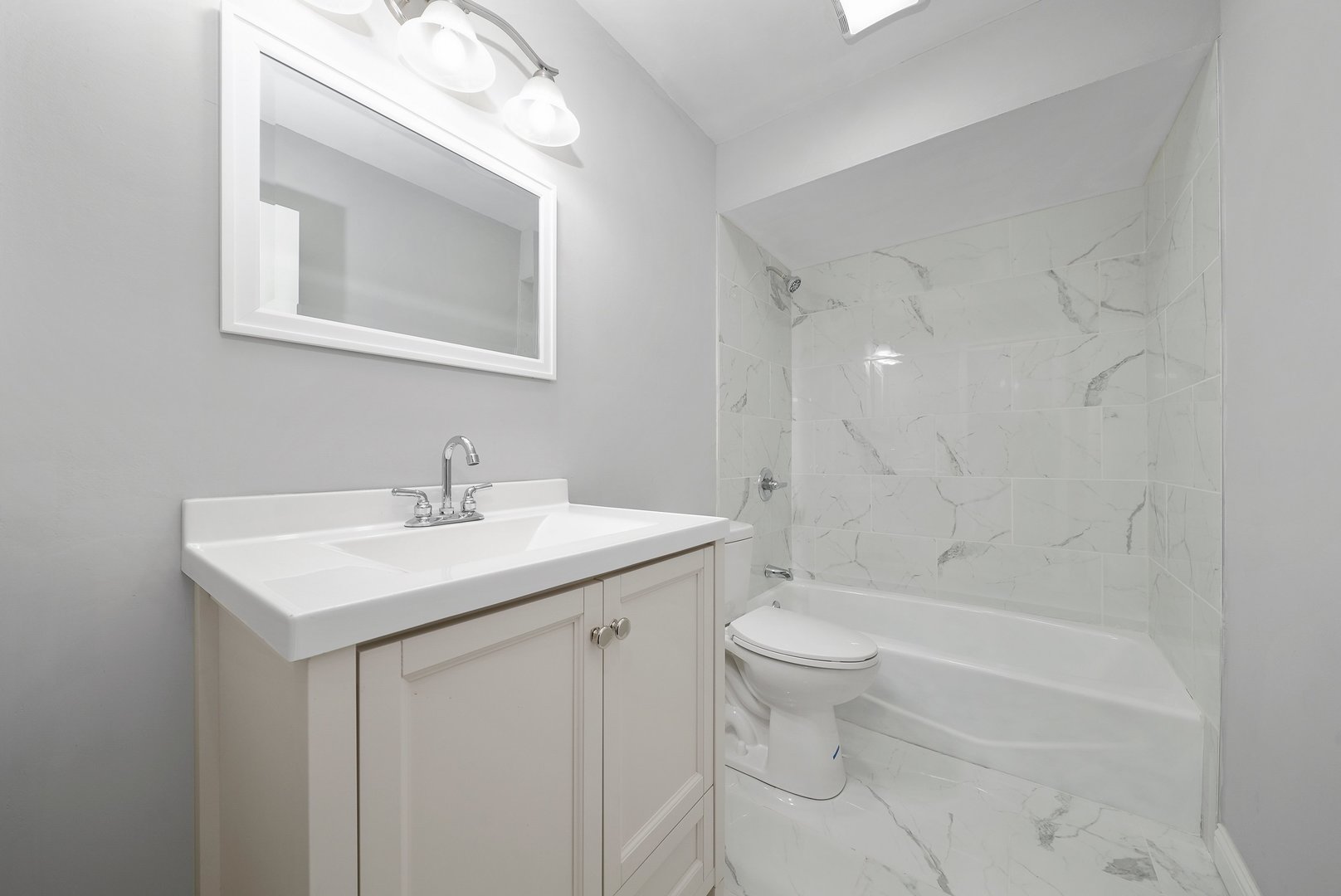 17522 Wright Street Lansing, IL 60438 - Photo 18 of 21 a bathroom with a sink toilet and shower