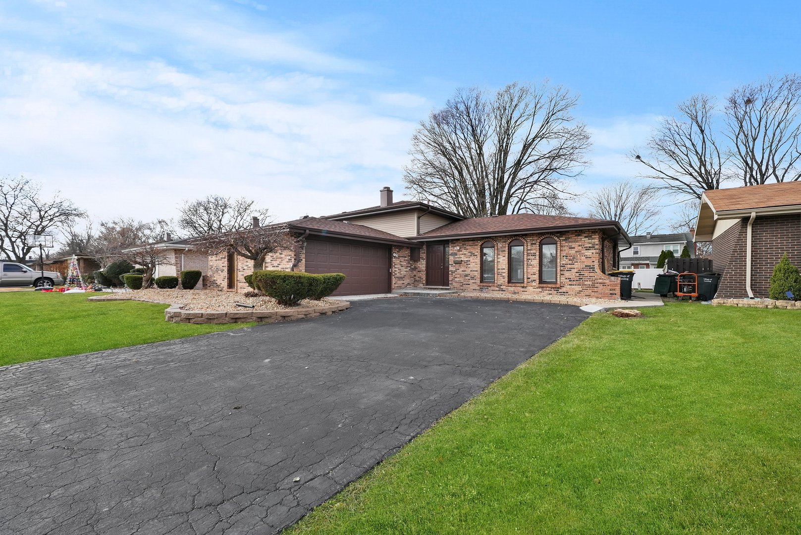 17522 Wright Street Lansing, IL 60438 - Photo 3 of 21 a view of a yard in front of a house