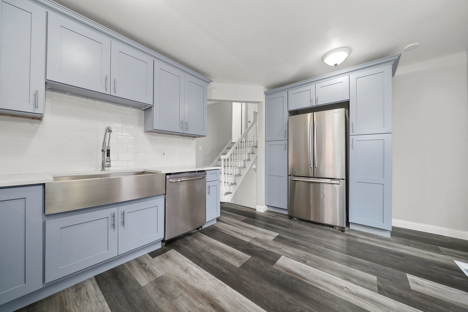 17522 Wright Street Lansing, IL 60438 - Photo 10 of 21 a kitchen with a sink a refrigerator and cabinets