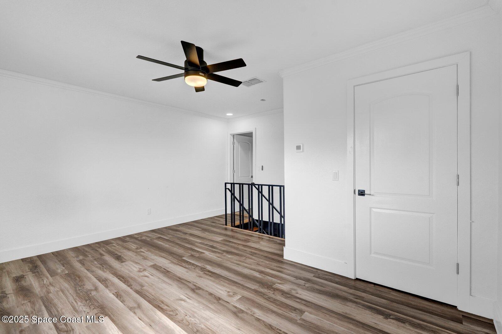 3912 Overlook Drive, Unit 38 Palm Bay, FL 32905 - Photo 15 of 20 a view of empty room with wooden floor