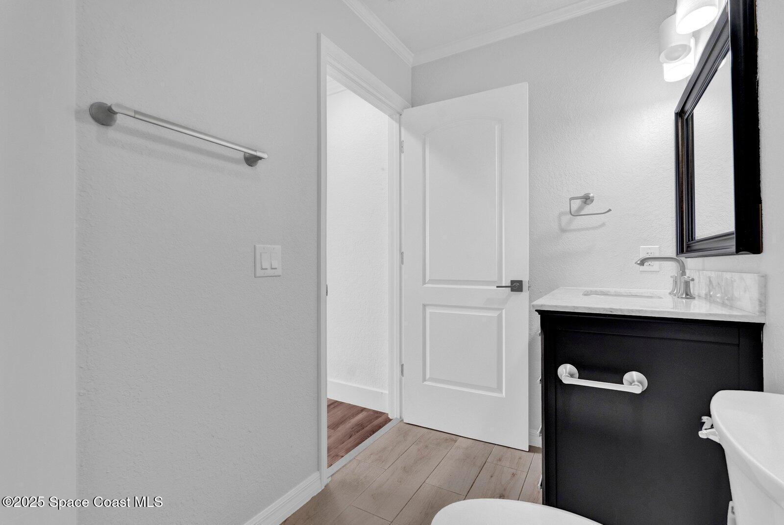 3912 Overlook Drive, Unit 38 Palm Bay, FL 32905 - Photo 19 of 20 a bathroom with a sink and mirror