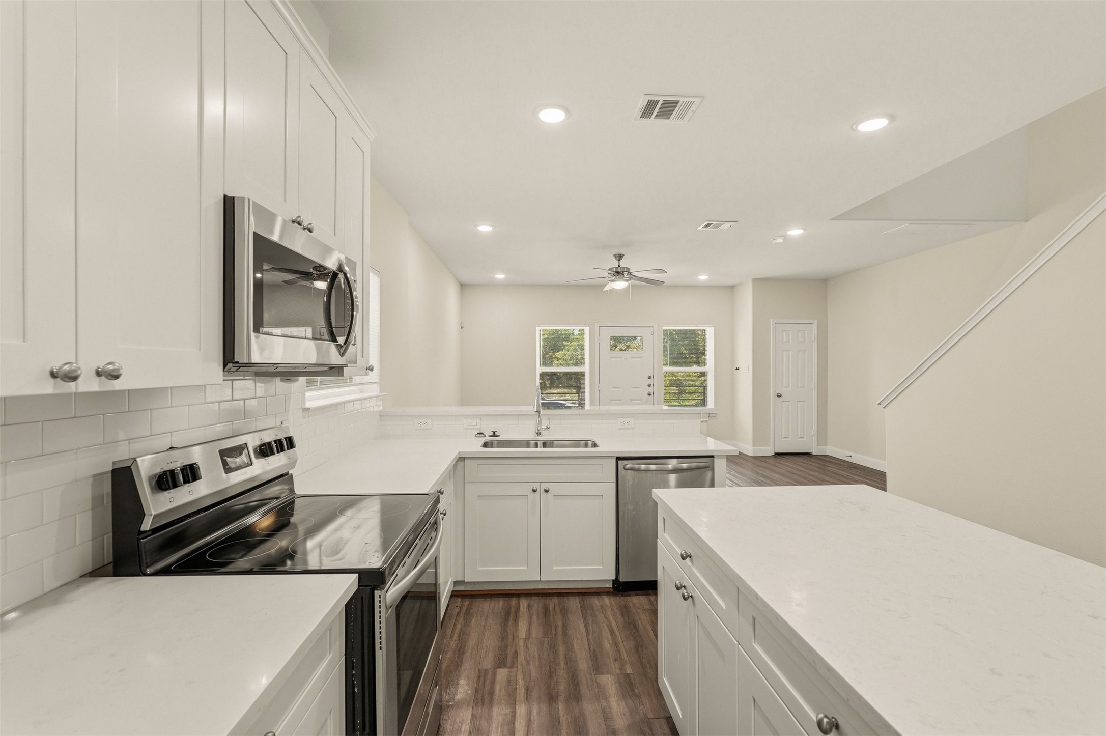2218 Bringhurst Street, Unit B Houston, TX 77026 - Photo 11 of 25 a kitchen with a sink stove and microwave
