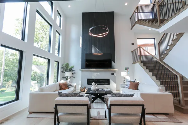 a living room with furniture a fireplace and a flat screen tv