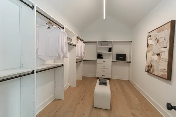 a kitchen with stainless steel appliances a refrigerator and cabinets