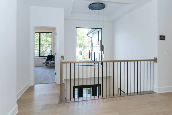wooden floor in a hall with a window
