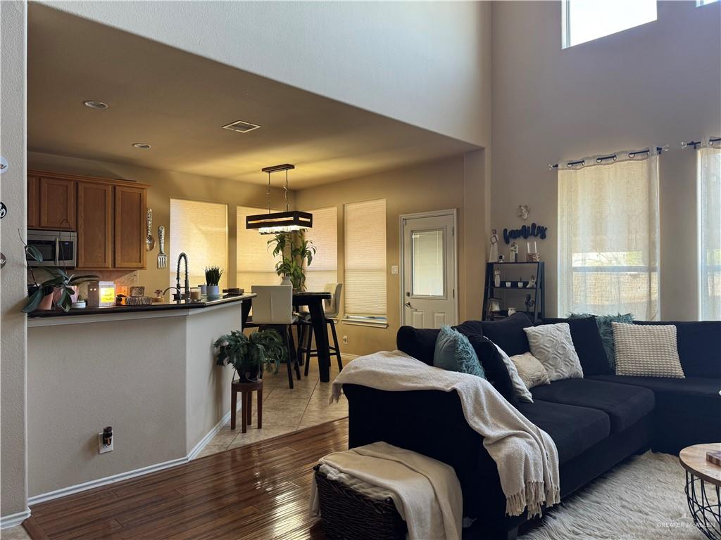 3407 San Angelo Street Mission, TX 78572 - Photo 14 of 40 a living room with furniture and a wooden floor