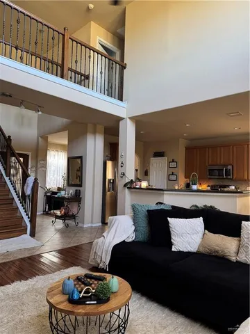a living room with furniture a rug and a fireplace