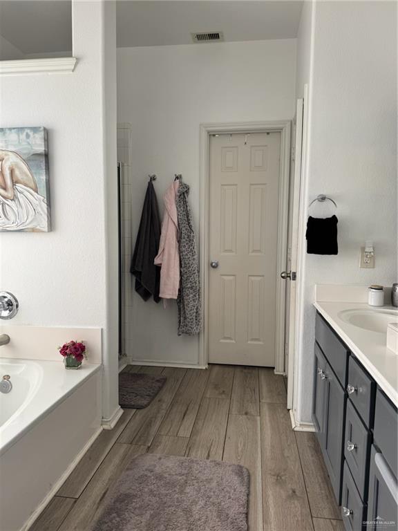 3407 San Angelo Street Mission, TX 78572 - Photo 25 of 40 a view of walk in closet with clothes and shoes