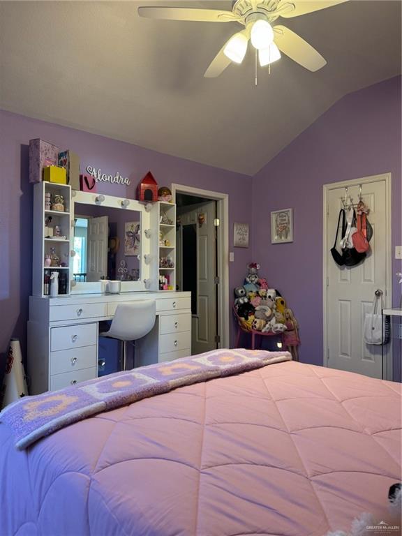 3407 San Angelo Street Mission, TX 78572 - Photo 32 of 40 a bedroom with a bed and a chandelier