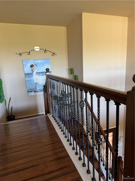 3407 San Angelo Street Mission, TX 78572 - Photo 34 of 40 a view of a hallway with wooden floor and staircase