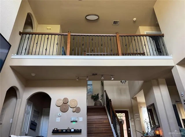 a view of staircase with wooden floor